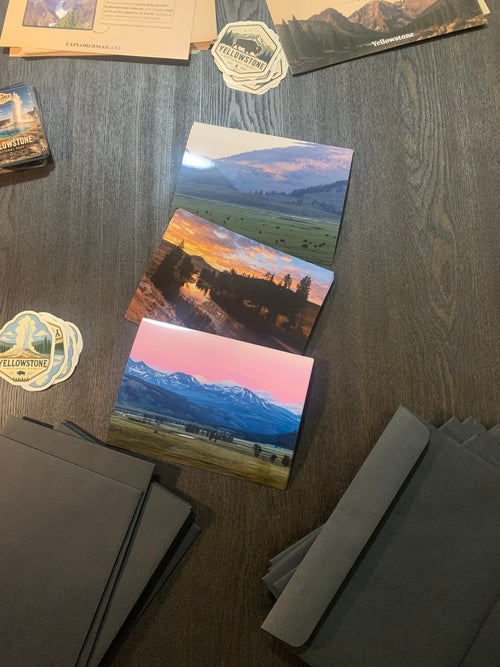 Explorer Mail National Park photo prints and sticker beside mailing envelopes